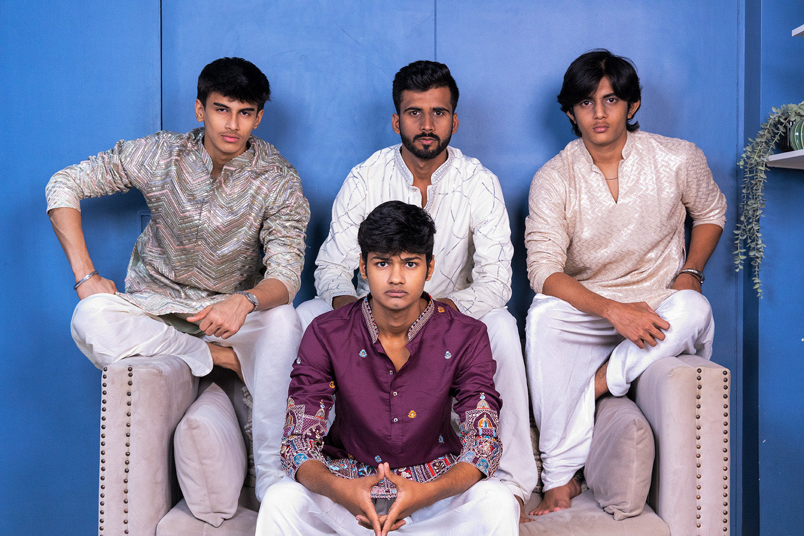 Four men in traditional Kurtas (men's ethnic wear)